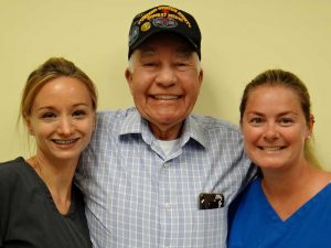 Group photo with man with braces
